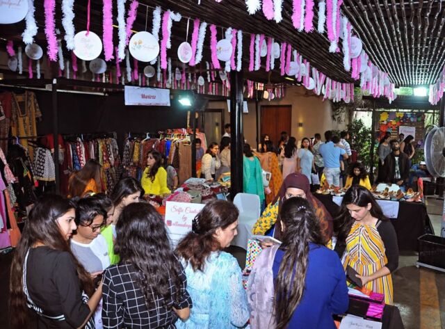 Shoppers browsing designer stalls at a Style Loft pop-up