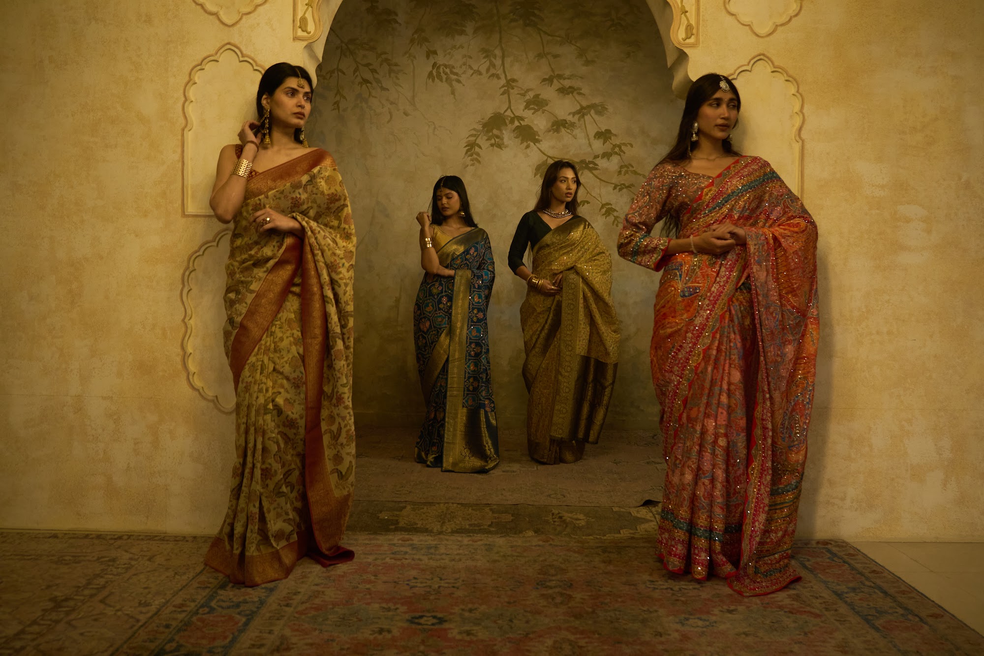Models in handwoven sarees under palace arches, Ayush Sharma Sarees